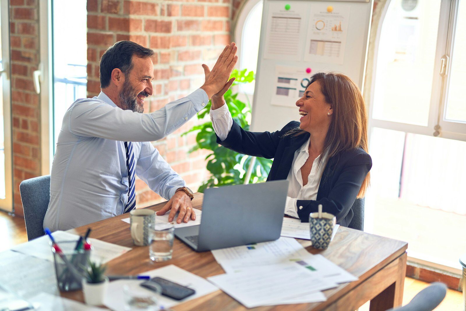 Two people celebrating a passed CCL test with a high-five
